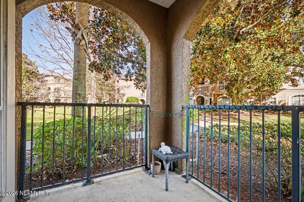 10961 Burnt Mill Road, Unit 1017 Jacksonville, FL 32256 - Photo 9 of 26 a view of a chair and table in the balcony