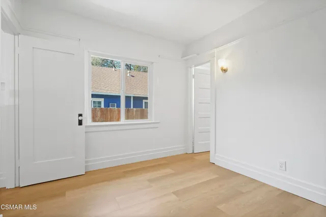 a view of empty room with windows