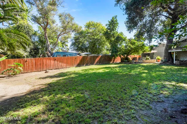 a view of a backyard with a small cabin