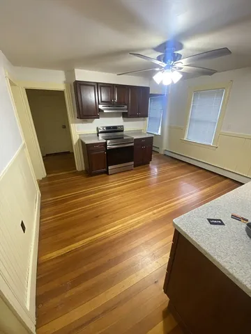 a kitchen with stainless steel appliances a stove microwave and cabinets