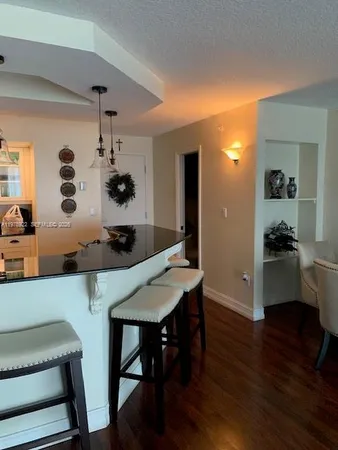a kitchen with a table and chairs in it
