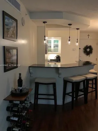 a kitchen with a table and chairs in it