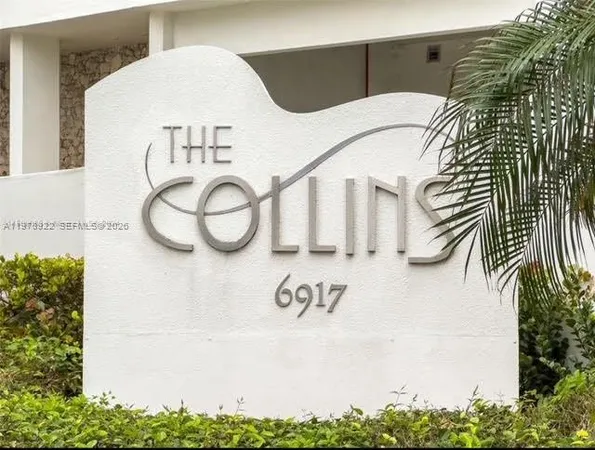 a white house with a potted plant on it