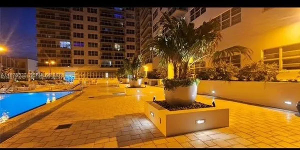 a view of swimming pool with outdoor seating