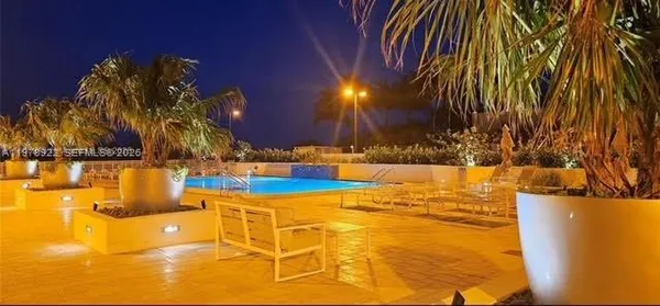 a view of swimming pool with an outdoor space and seating area