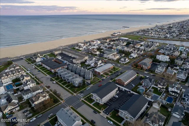 an aerial view of a house with a ocean view