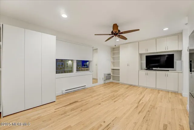 a kitchen with a white cabinets and white appliances