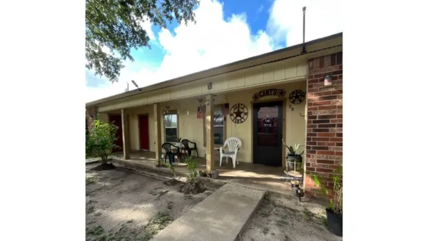 a view of a house with chair and porch