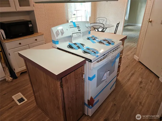 a living room with furniture and flat screen tv
