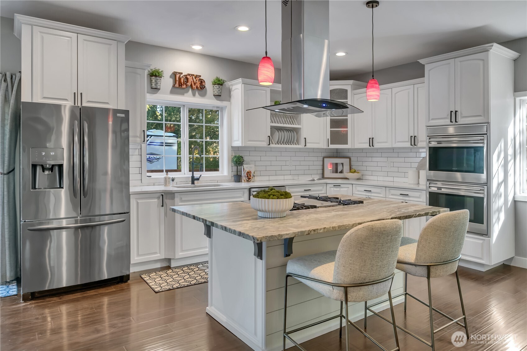 204 5th Avenue Milton, WA 98354 - Photo 14 of 37 a kitchen with stainless steel appliances granite countertop a sink refrigerator and microwave