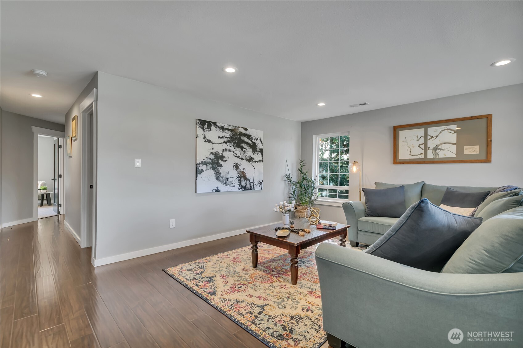 204 5th Avenue Milton, WA 98354 - Photo 21 of 37 a living room with furniture and wooden floor