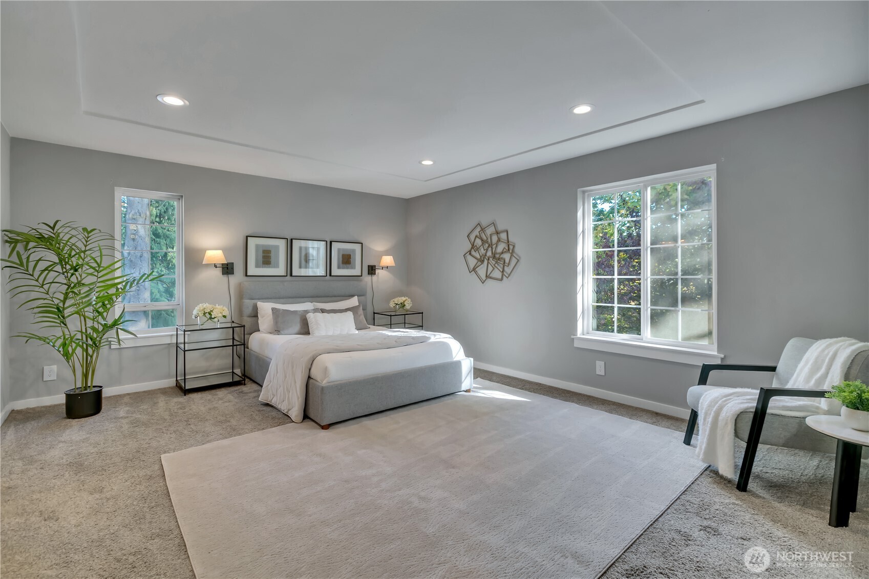 204 5th Avenue Milton, WA 98354 - Photo 23 of 37 a spacious bedroom with a large bed and a couch