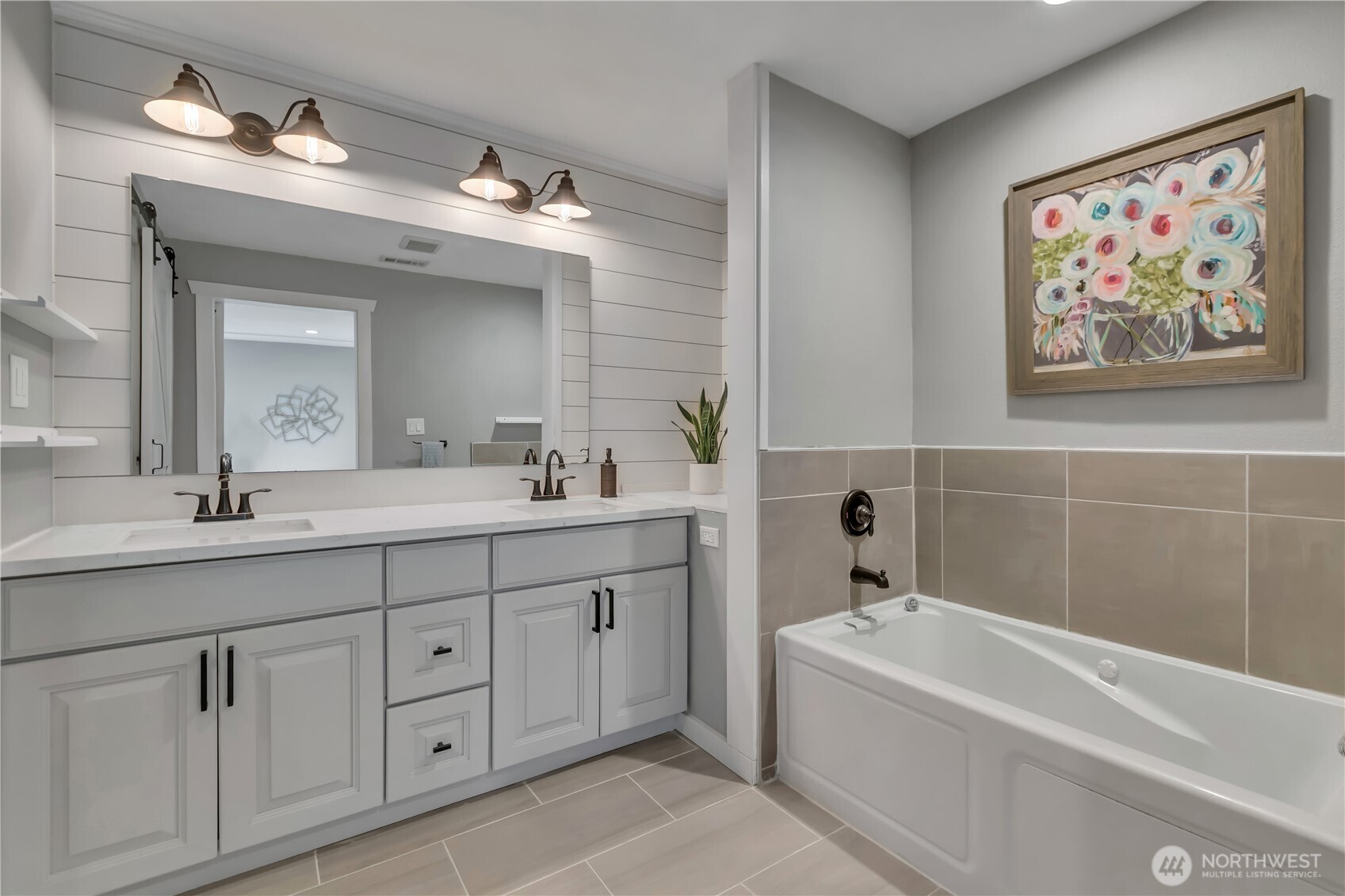204 5th Avenue Milton, WA 98354 - Photo 25 of 37 a bathroom with a tub a sink and mirror