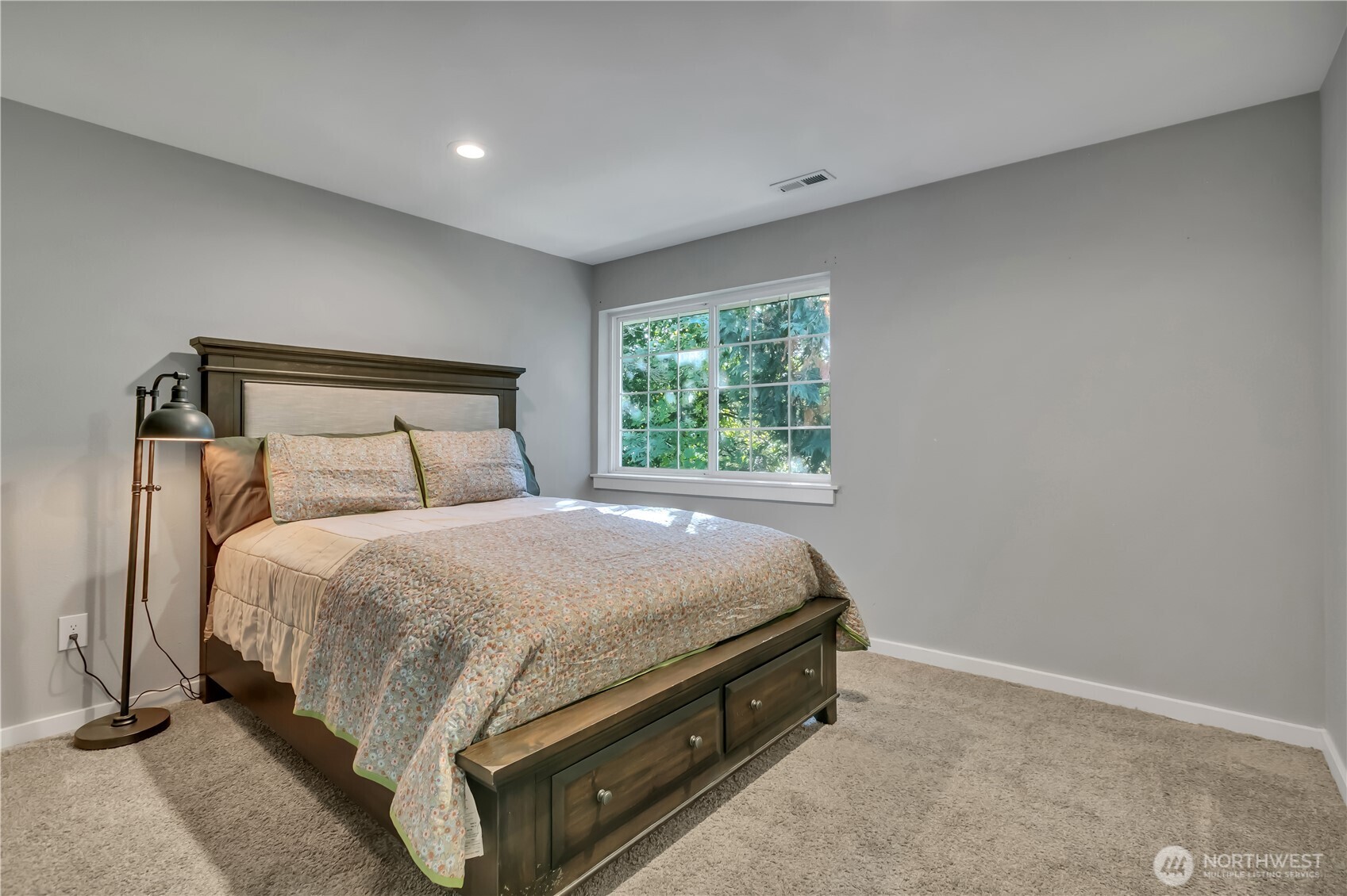 204 5th Avenue Milton, WA 98354 - Photo 28 of 37 a bed sitting in a spacious bedroom next to a window