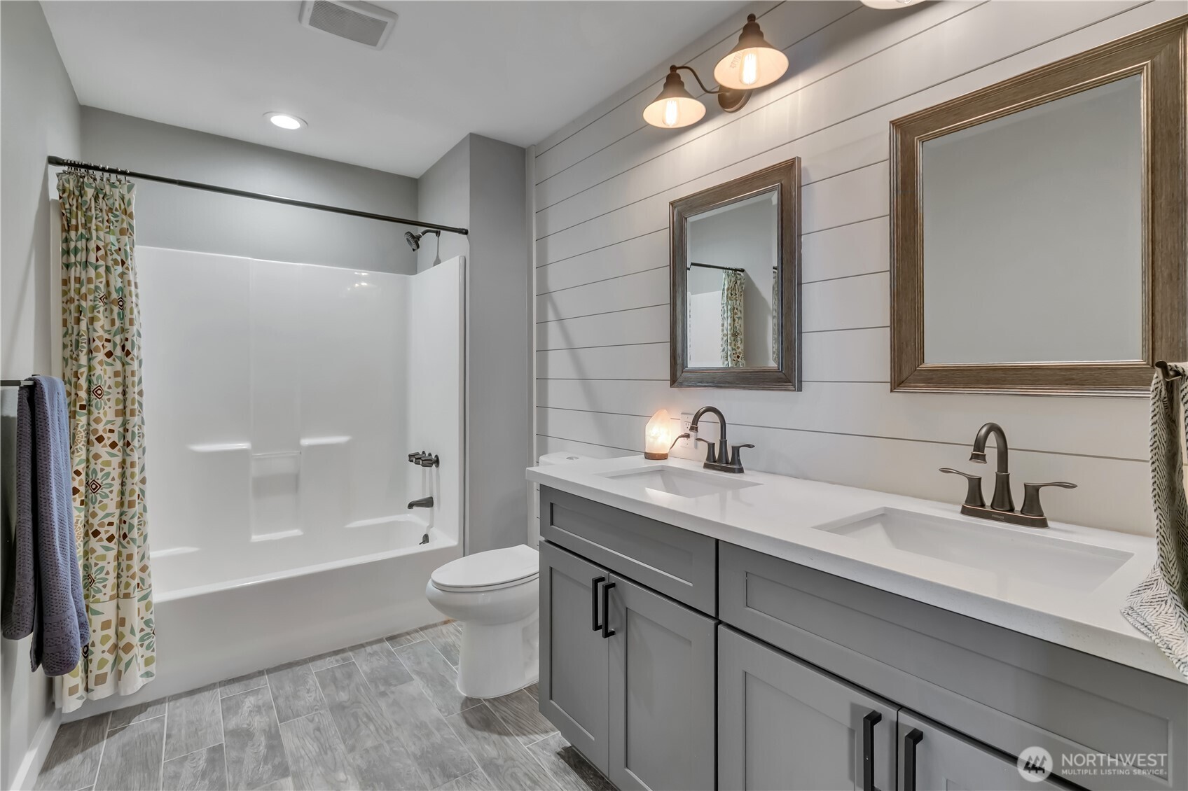 204 5th Avenue Milton, WA 98354 - Photo 29 of 37 a bathroom with a sink a toilet and shower