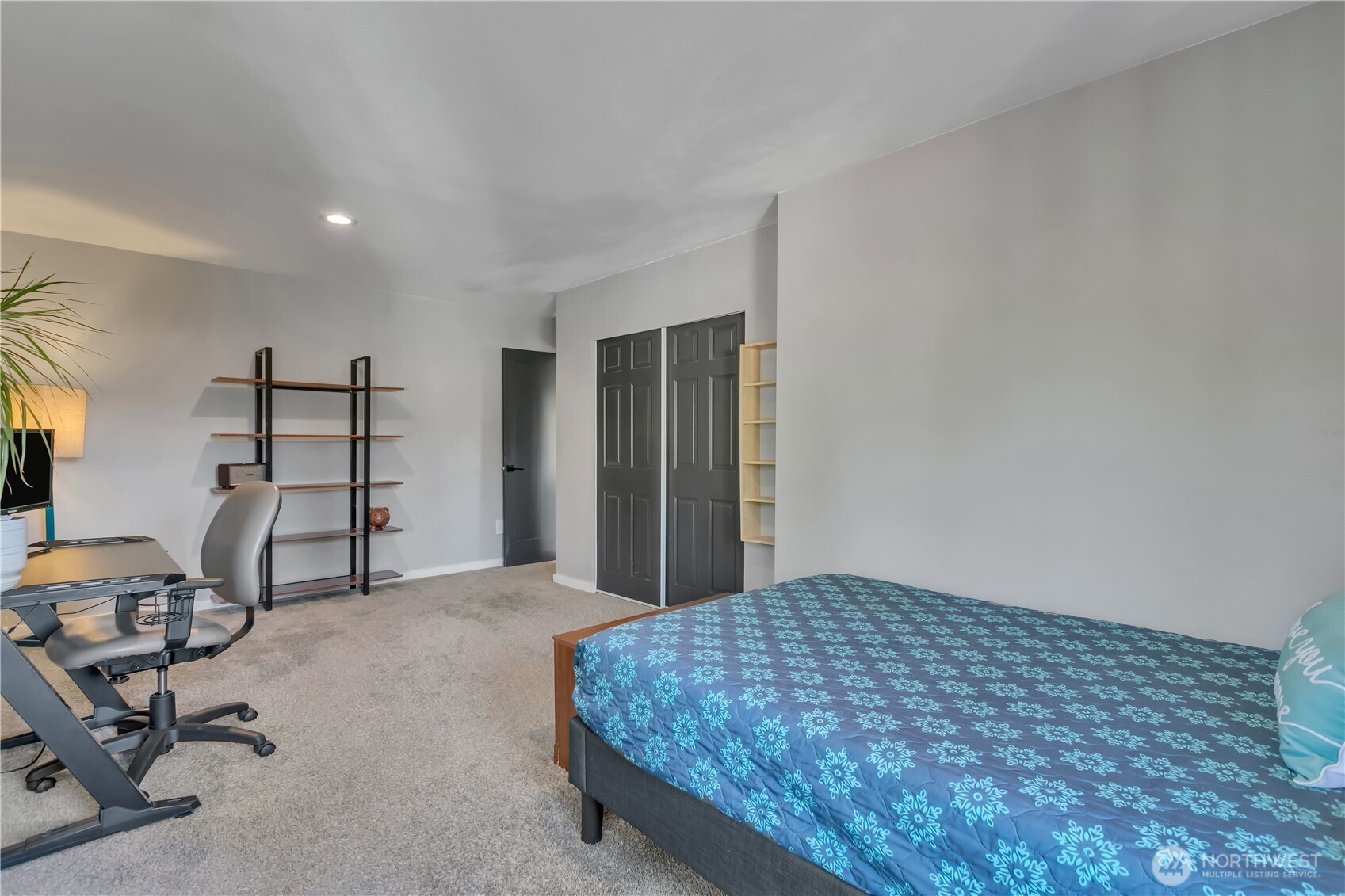 204 5th Avenue Milton, WA 98354 - Photo 31 of 37 a bedroom with a bed a desk and chair