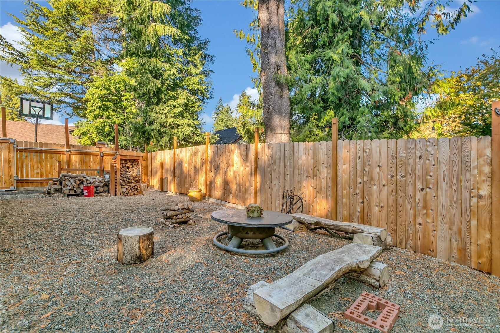 204 5th Avenue Milton, WA 98354 - Photo 33 of 37 a backyard of a house with table and chairs