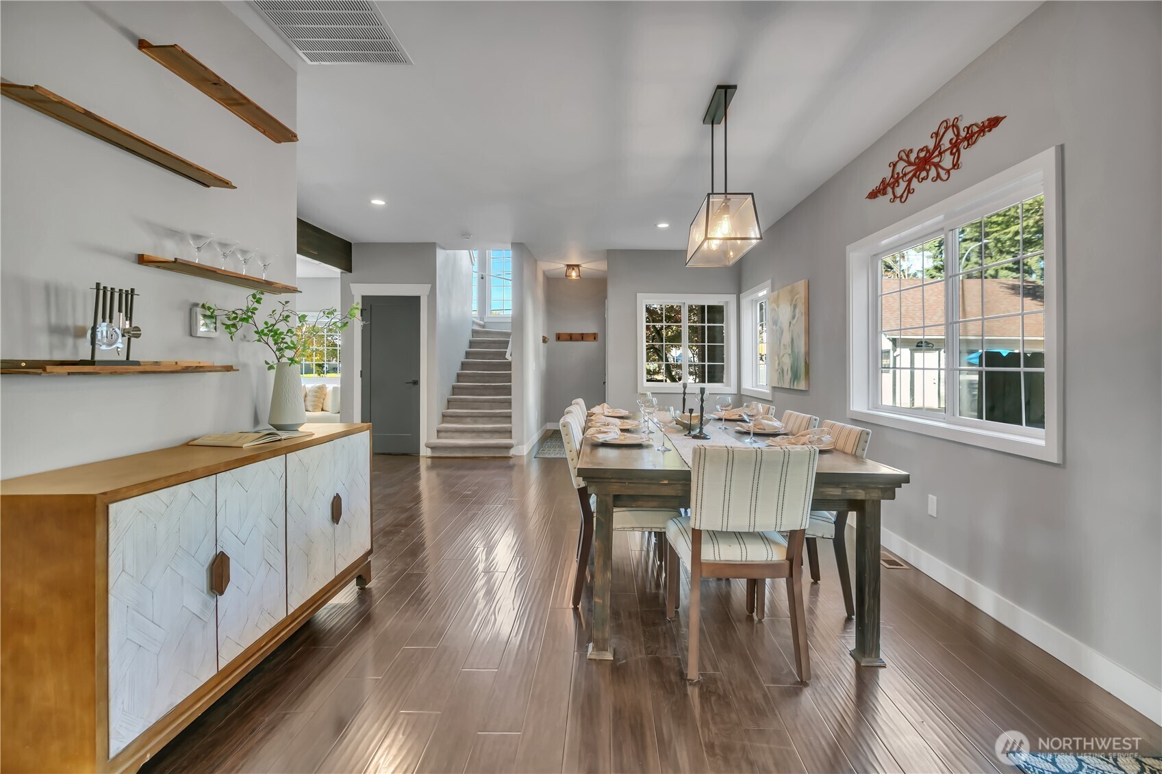 204 5th Avenue Milton, WA 98354 - Photo 7 of 37 a kitchen with stainless steel appliances granite countertop furniture wooden floor and a dining table