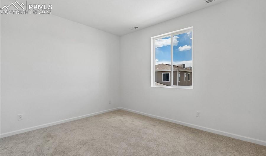 2485 Serviceberry Grove Colorado Springs, CO 80915 - Photo 10 of 22 a room that has a window in it