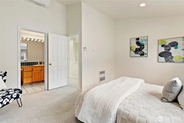 a bedroom with a bed and a cabinets