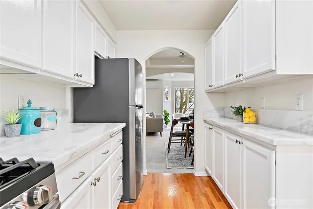 a kitchen with cabinets and appliances