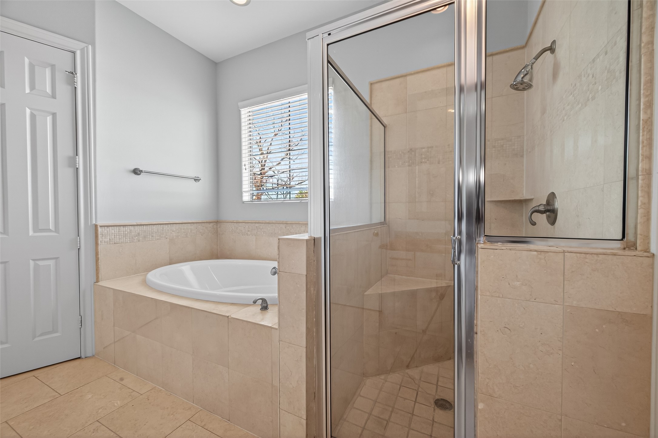 1105 Wagner Street Houston, TX 77007 - Photo 12 of 27 a bathroom with a bathtub a shower a sink and a mirror