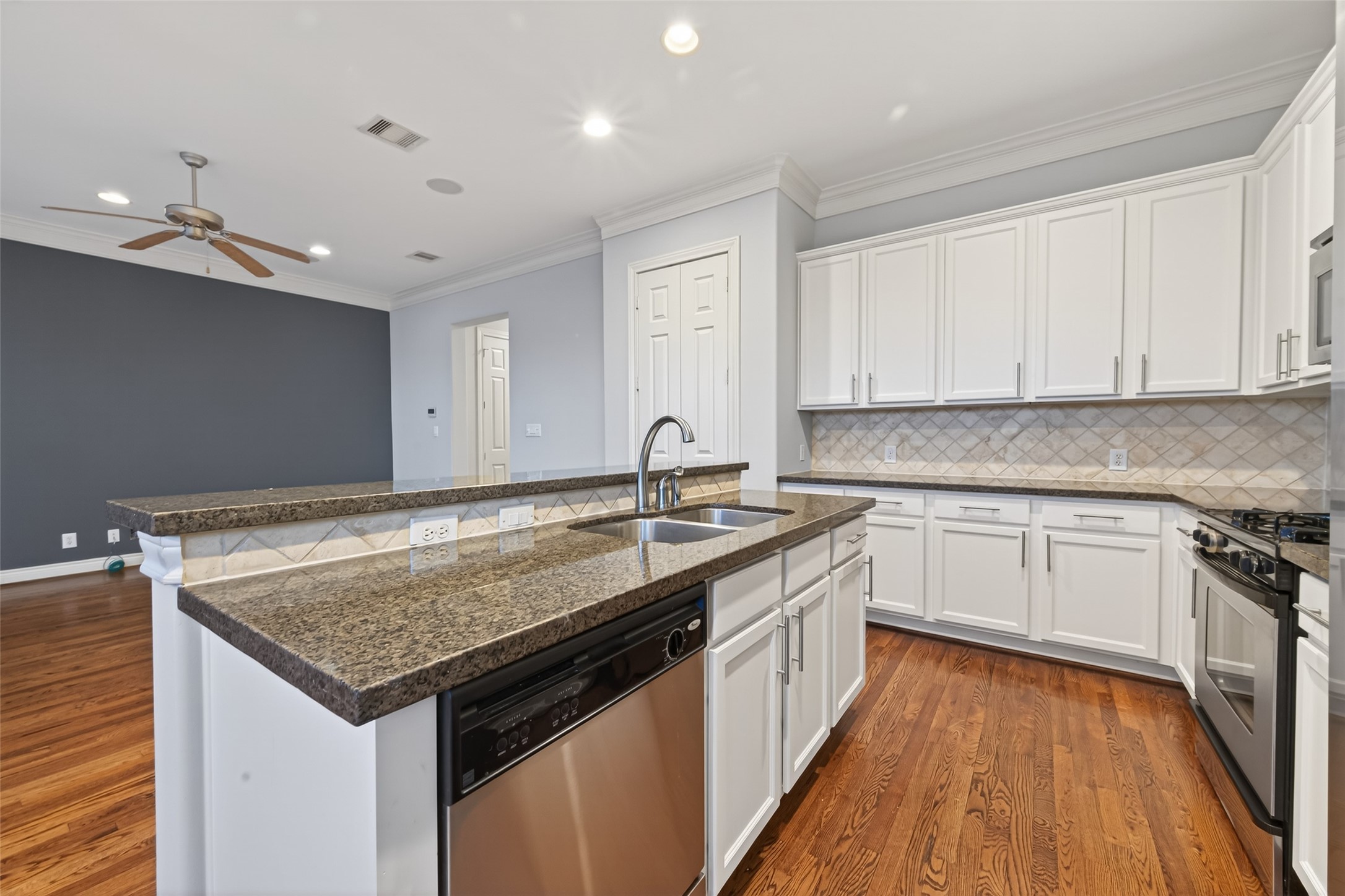 1105 Wagner Street Houston, TX 77007 - Photo 6 of 27 a kitchen with sink stove and cabinets