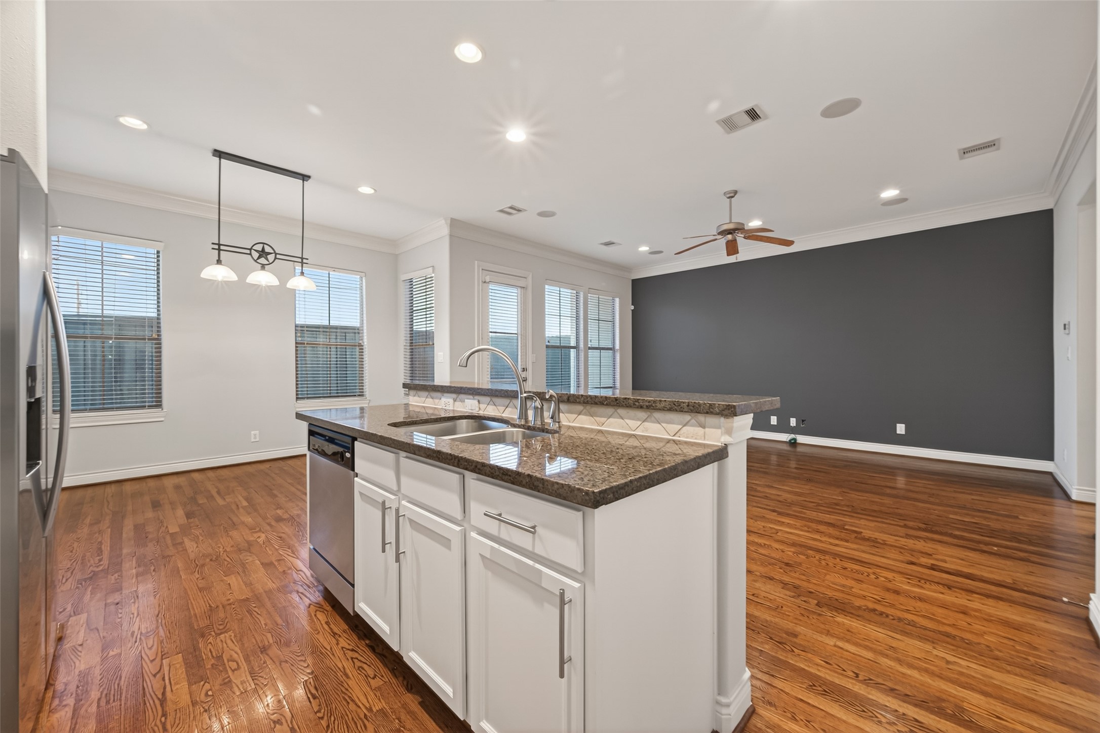 1105 Wagner Street Houston, TX 77007 - Photo 7 of 27 a kitchen with stainless steel appliances granite countertop a stove and a wooden floors