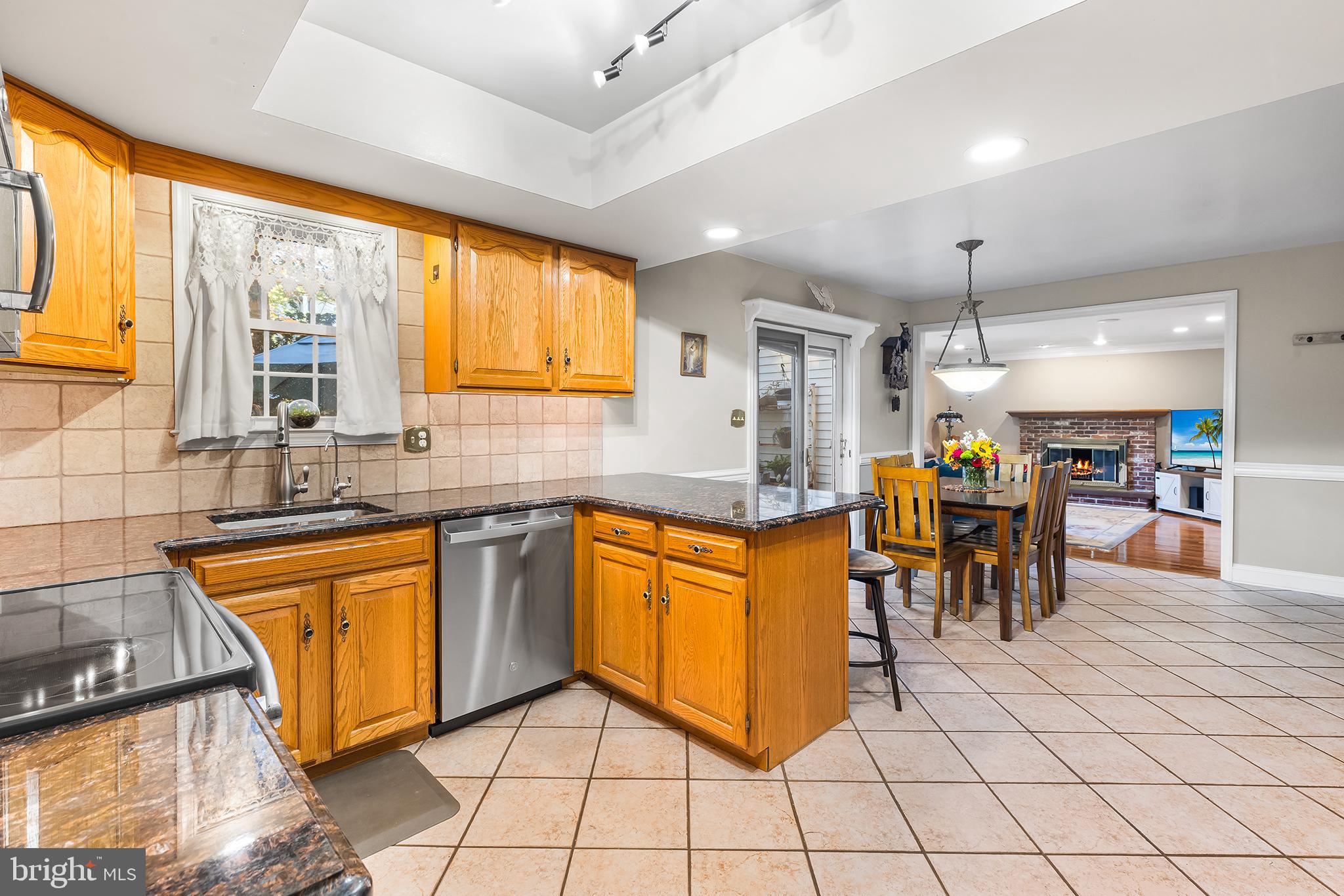 511 Faith Drive Norristown, PA 19403 - Photo 12 of 39 a kitchen with stainless steel appliances granite countertop a refrigerator and a sink