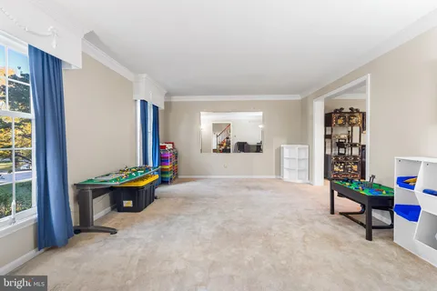 a living room with furniture and next to a window