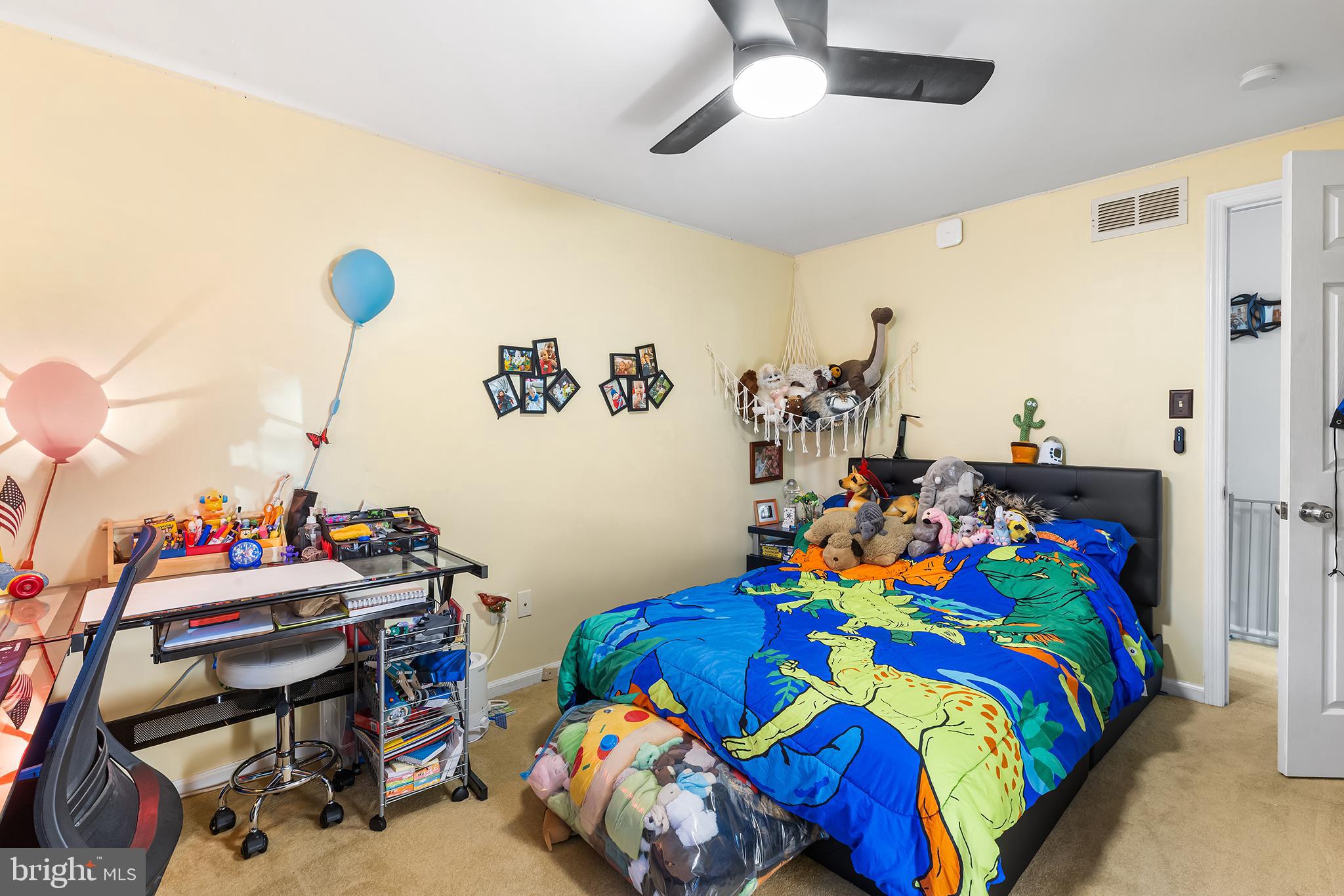 511 Faith Drive Norristown, PA 19403 - Photo 19 of 39 a bedroom with a bed and a chandelier