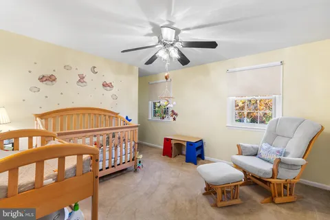 a bedroom with furniture and a chandelier