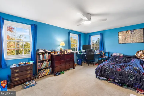 a bed room with furniture and a window