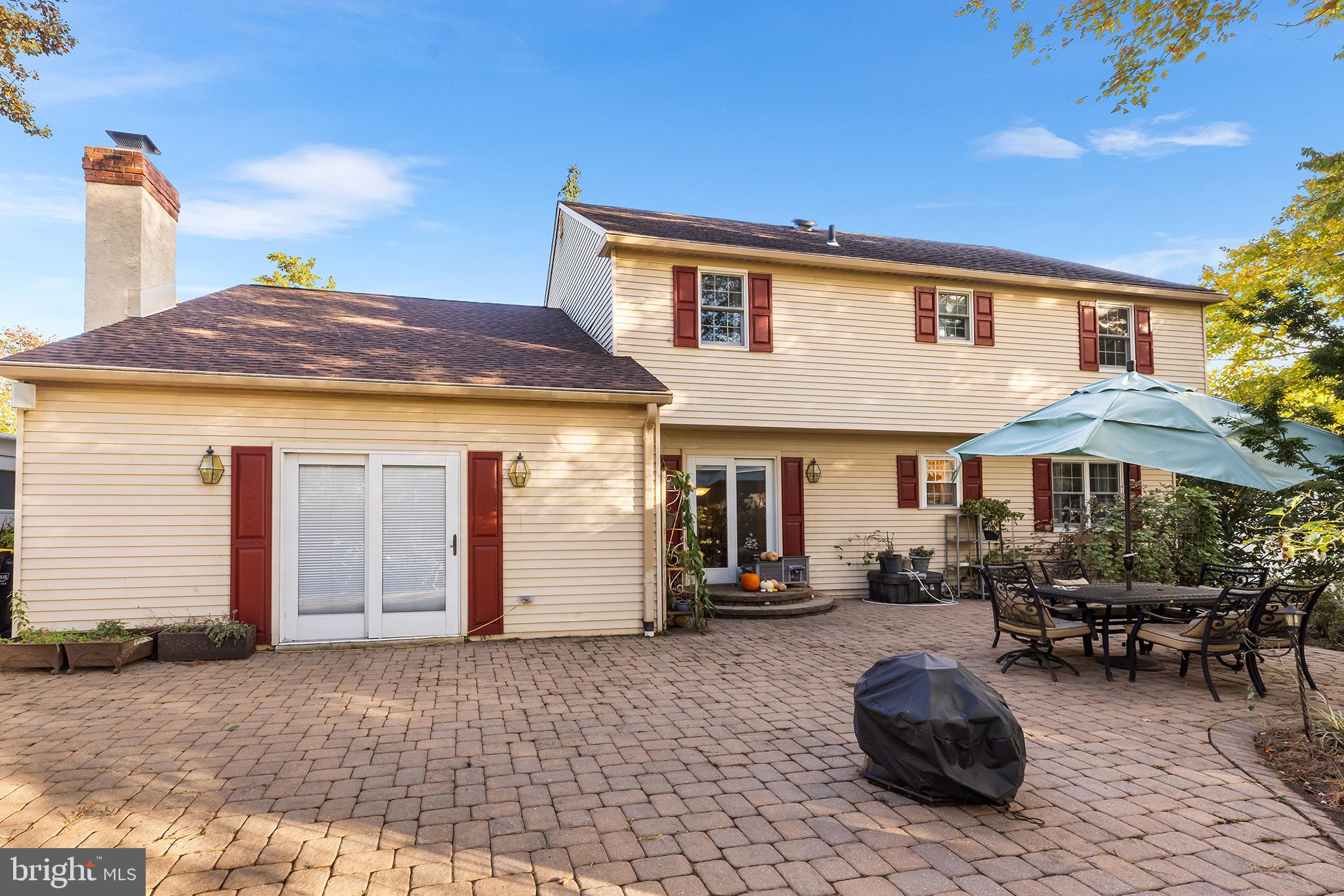 511 Faith Drive Norristown, PA 19403 - Photo 33 of 39 a backyard of a house with barbeque oven table and chairs