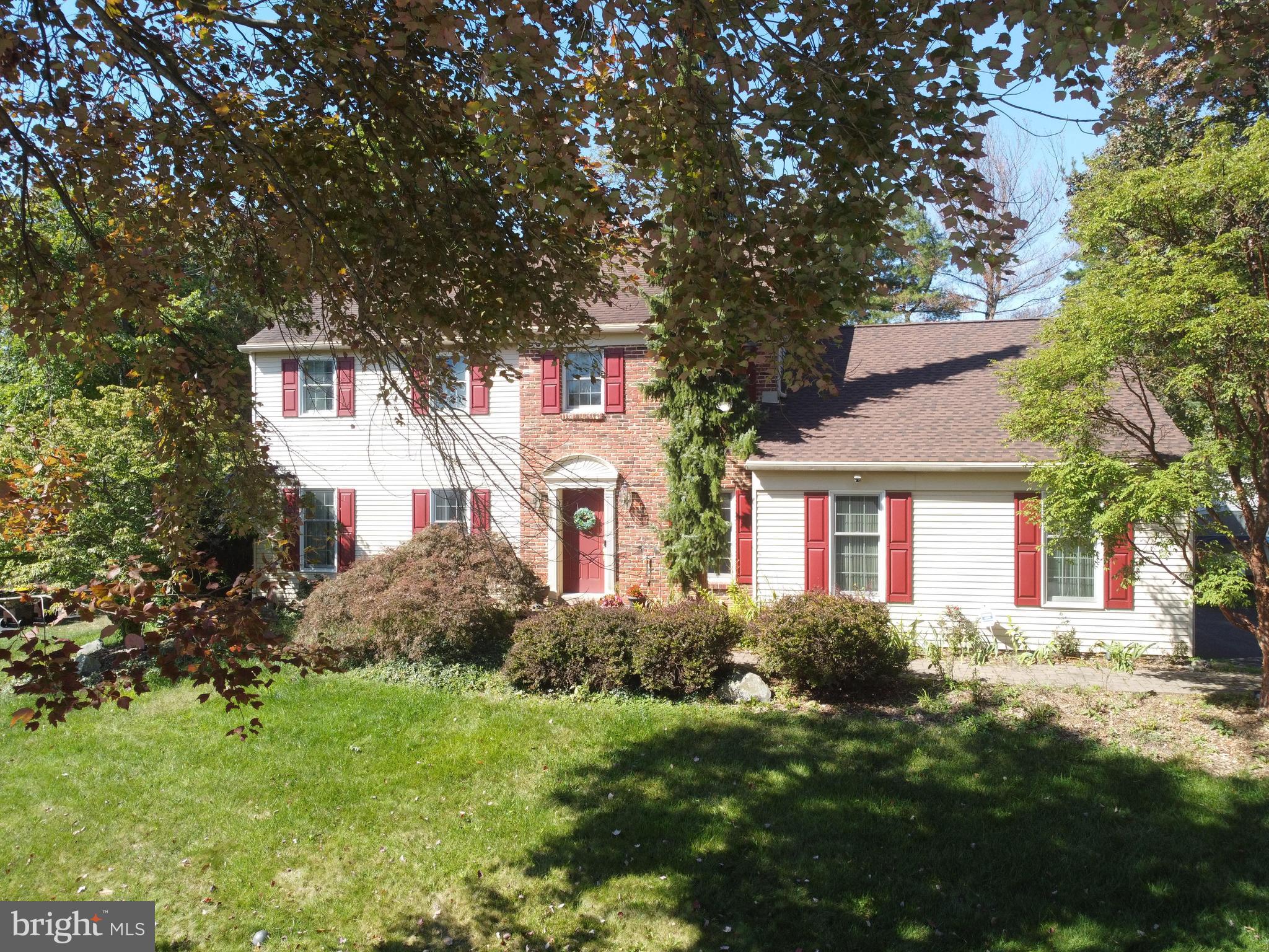 511 Faith Drive Norristown, PA 19403 - Photo 38 of 39 a front view of house with yard and trees