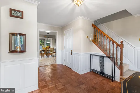 a view of entryway and hall with dining room