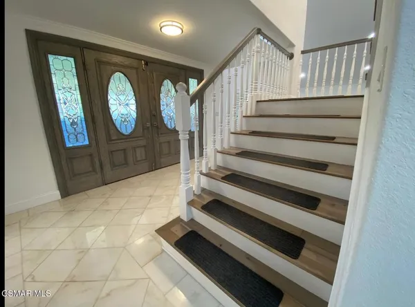 a view of a hallway with entryway