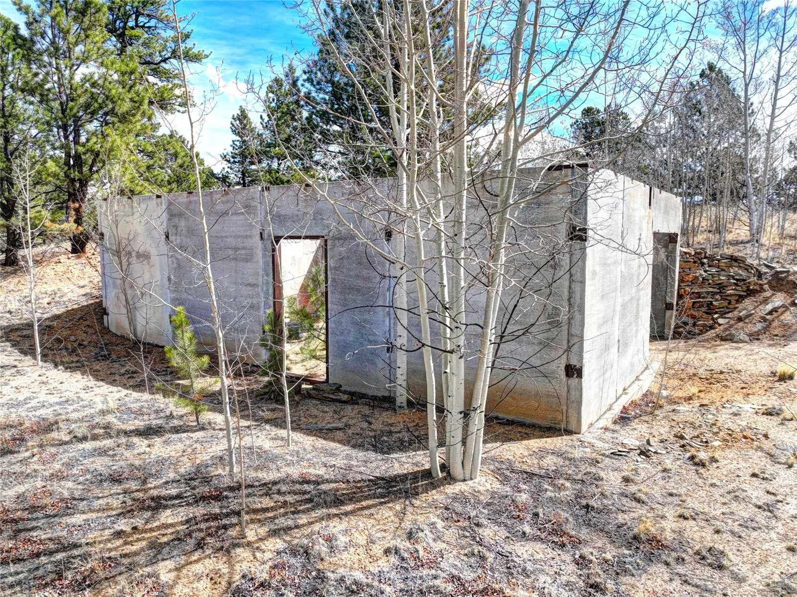 101 Patch Court Como, CO 80432 - Photo 5 of 23 a brick house with a large tree