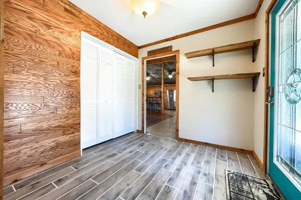 a dining room with furniture and wooden floor
