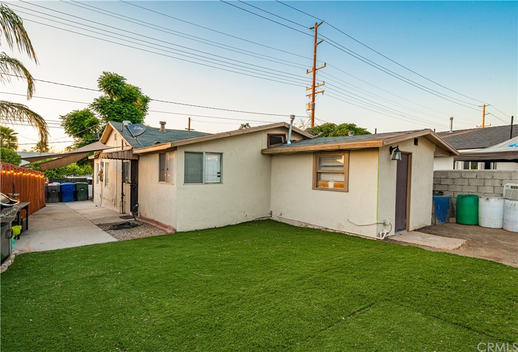7434 Evans Street Riverside, CA 92504 - Photo 13 of 16 a backyard of a house with table and chairs