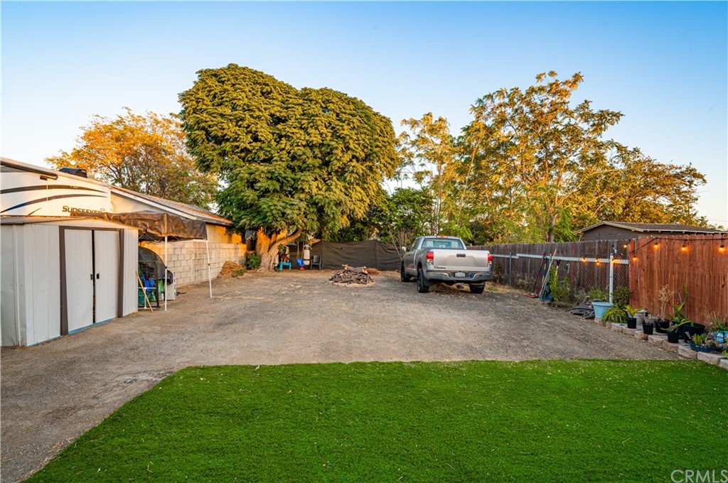 7434 Evans Street Riverside, CA 92504 - Photo 14 of 16 a view of backyard with parked car