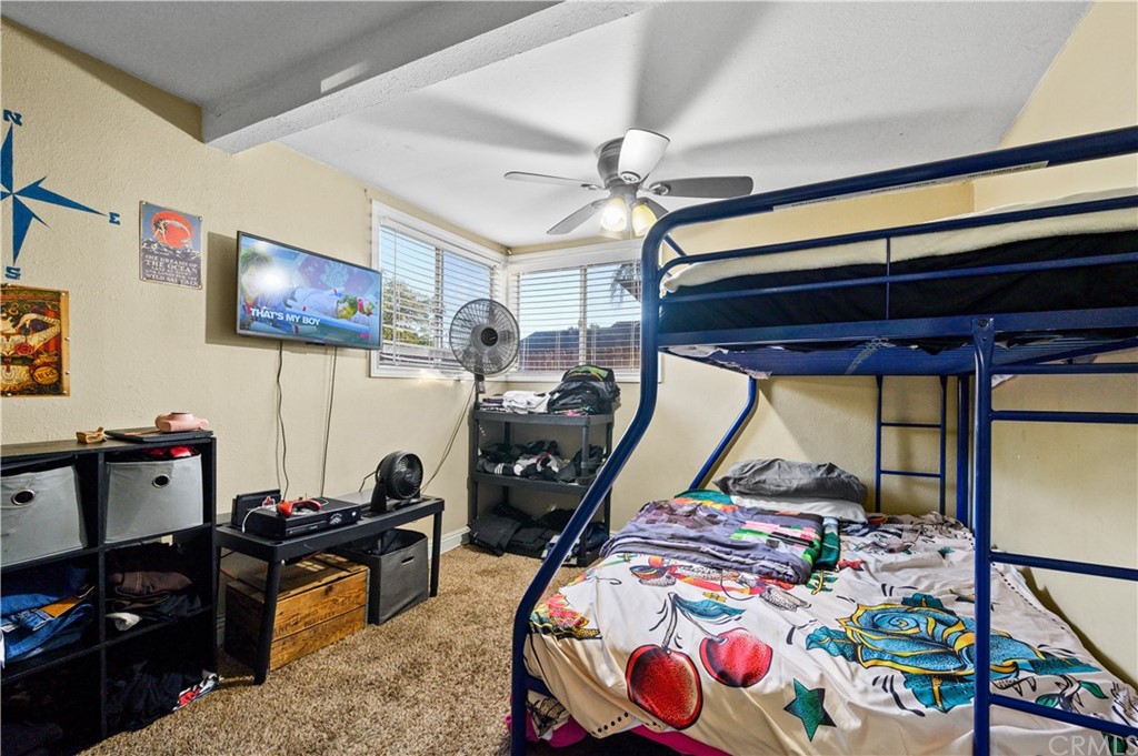 7434 Evans Street Riverside, CA 92504 - Photo 9 of 16 a bedroom with bed and a window
