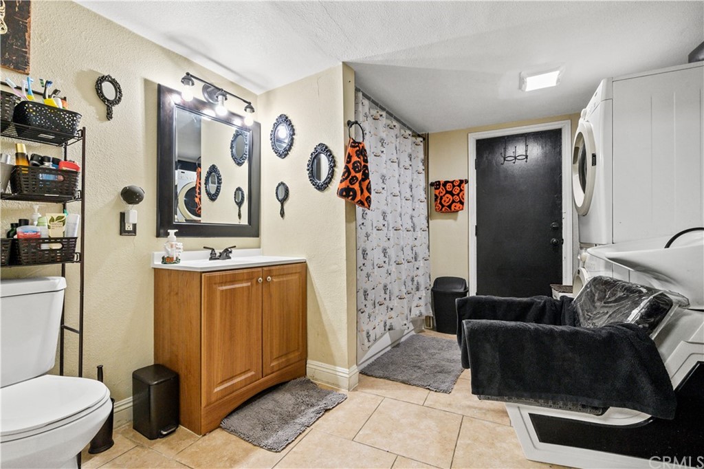 7434 Evans Street Riverside, CA 92504 - Photo 10 of 16 a bathroom with a toilet and a shower