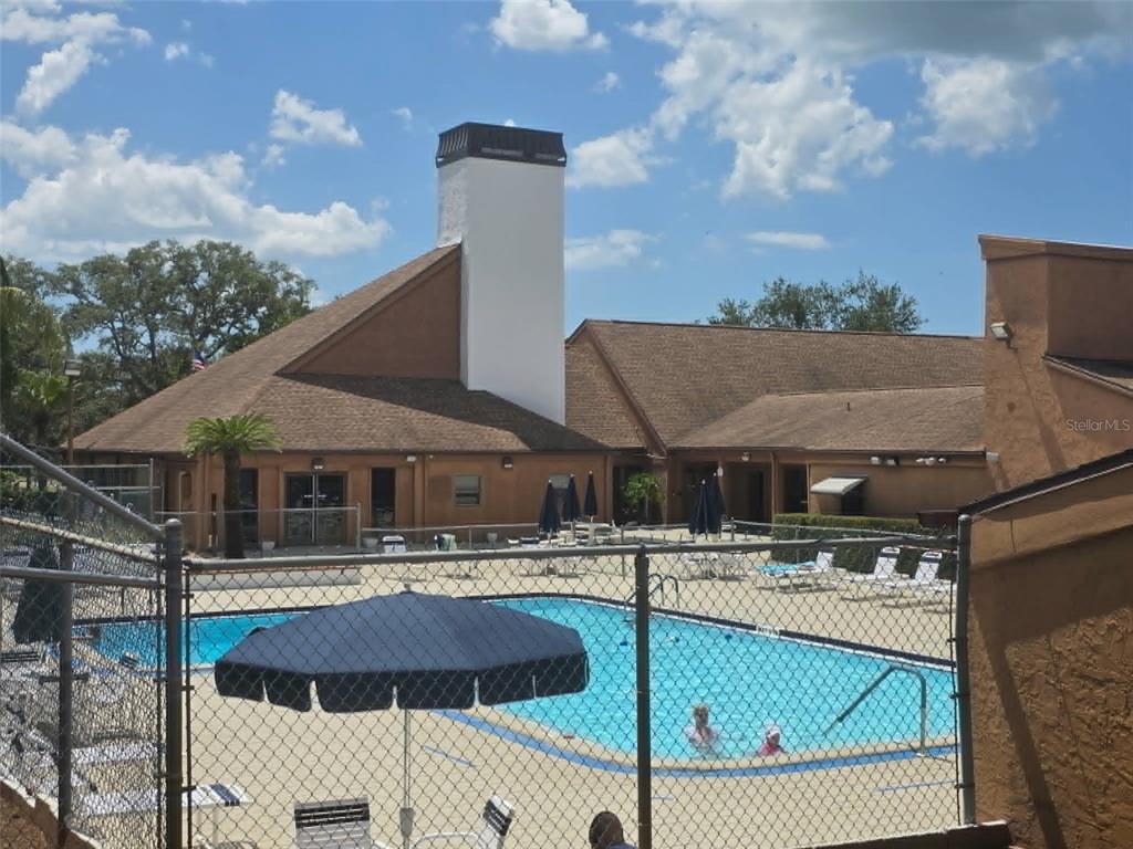 4392 Craftsbury Drive New Port Richey, FL 34652 - Photo 31 of 41 a aerial view of a house with pool table and chairs