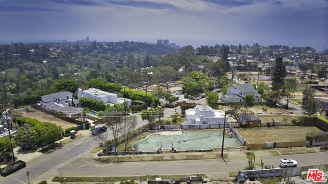 a view of a city with mountains