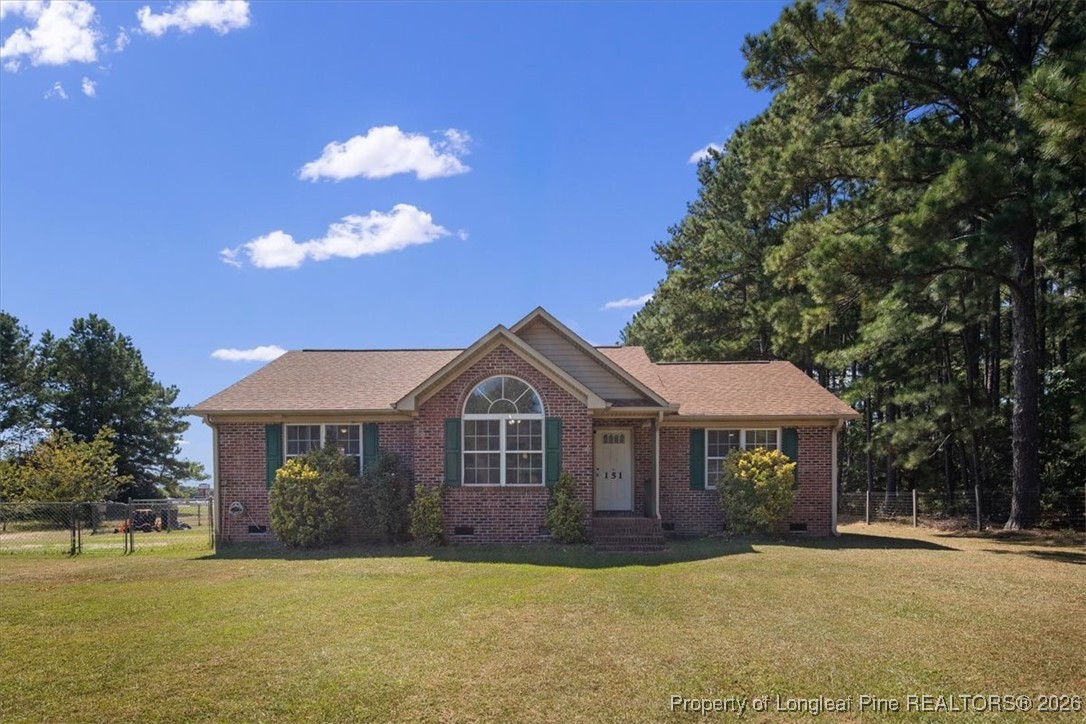 151 Ballard Drive Raeford, NC 28376 - Photo 1 of 34 a front view of a house with a yard
