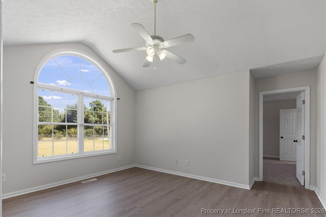 151 Ballard Drive Raeford, NC 28376 - Photo 7 of 34 an empty room with closet and a chandelier fan
