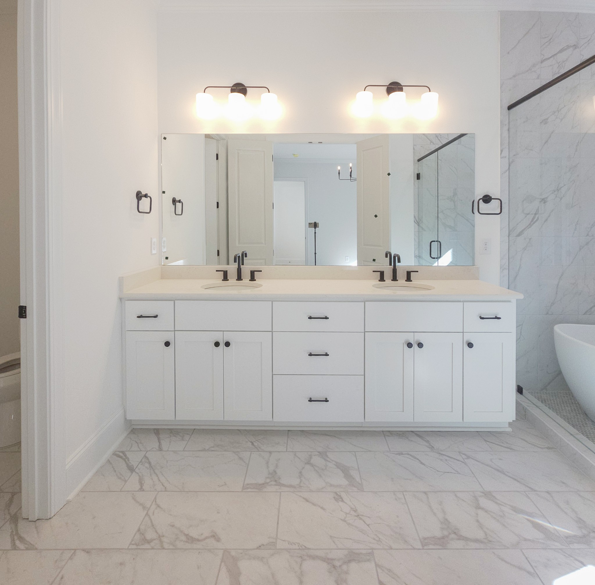 7147 Frances Street Fairview, TN 37062 - Photo 23 of 45 a spacious bathroom with a sink a toilet a large mirror and vanity