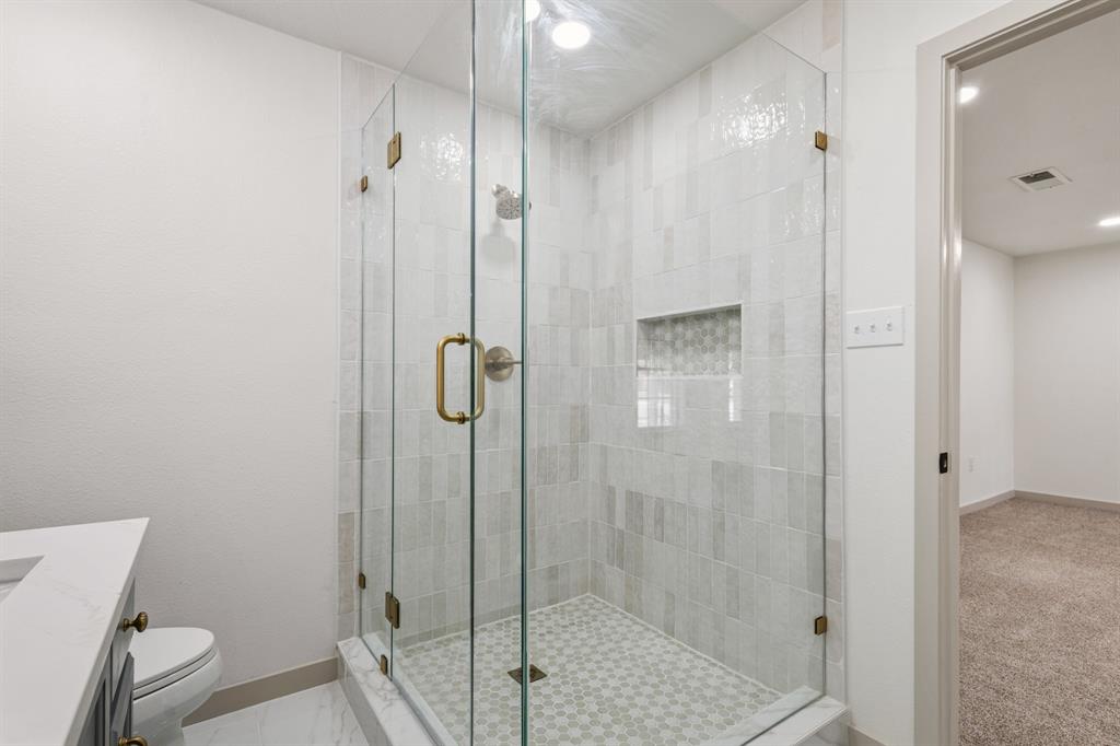 1510 Finley Road Irving, TX 75062 - Photo 13 of 17 a bathroom with a shower