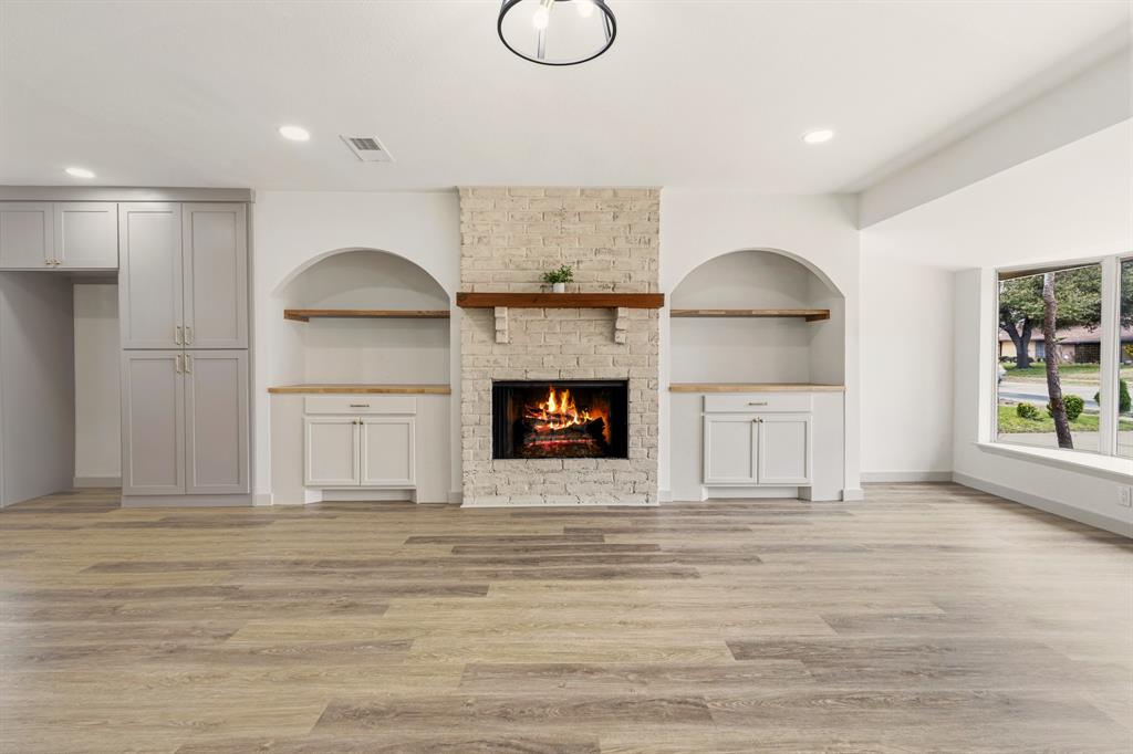 1510 Finley Road Irving, TX 75062 - Photo 4 of 17 a living room with furniture and a fireplace